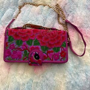 Blumera “Nadine” leather and fabric clutch